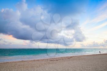 Atlantic ocean coast. Landscape with dramatic cloudy sky in sunrise, Dominican republic. Punta Cana. Bavaro beach