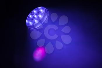 Stage LED spot light with purple blue beam, modern stage illumination equipment