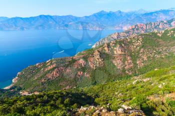 Rocks and sea in summer season. Coastal landscape of French mountainous Mediterranean island Corsica. Corse-du-Sud, Piana region