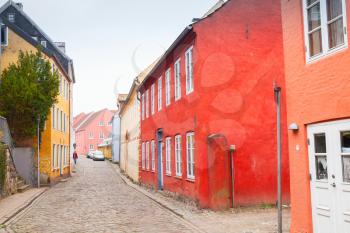 Colorful living houses along the street in old town of Flensburg city, Germany