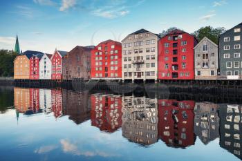 Traditional colorful wooden houses in old town of Trondheim, Norway. Coast of Nidelva river