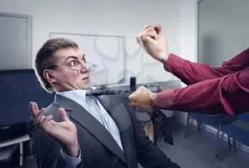 Aggressive office worker fighting with employee