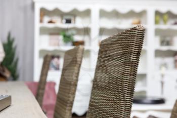 Wicker chairs in home interior close up
