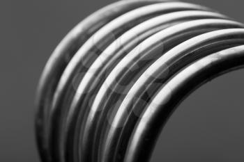 Aluminum spirals isolated on gray background close-up picture