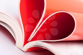 Closeup of book pages folded into a heart shape