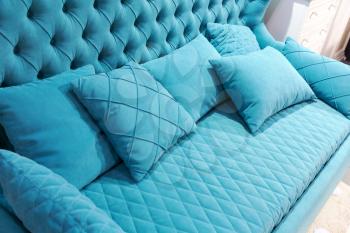 Close up of modern blue sofa