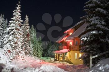 House in mountains. Night landscape