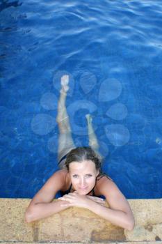Beautiful young woman in pool