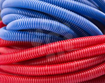 Closeup view of long red and blue water pipes