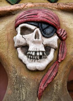 Pirate symbol - skull with eye patch and red bandana