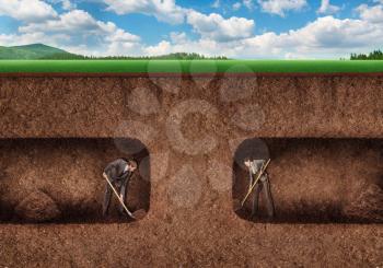 Businessman and businesswoman dig a tunnel underground towards each other