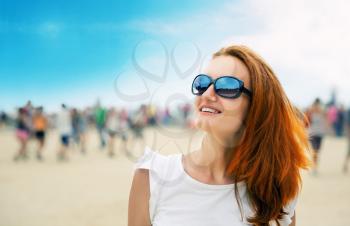 Happy young woman at a beach party