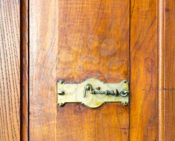 Close up of wooden cupboard with a hook lock
