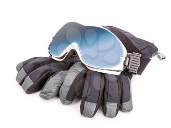 Winter sport glasses and gloves on white background