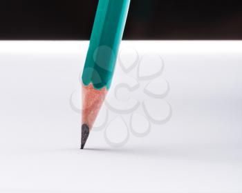 Sharp pencil on white paper