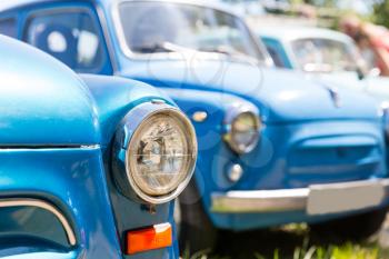 Line of blue retro cars close up