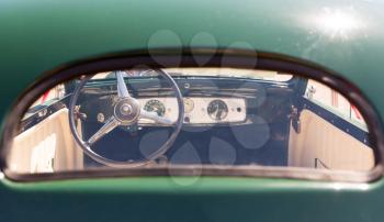 View of rudder through the glass of vintage car 