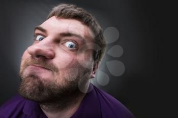 Frustrated man over grey background