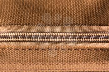 Brown texture with closed zipper