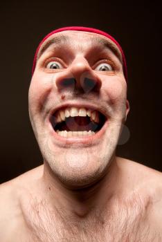 Close-up portrait of insane funny surprised man