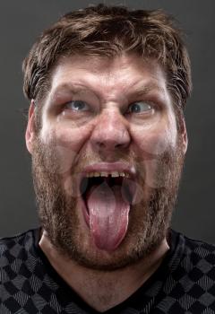 Portrait of crazy man making stupid face