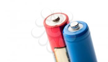 Two colourfull batteries isolated on white. Closeup