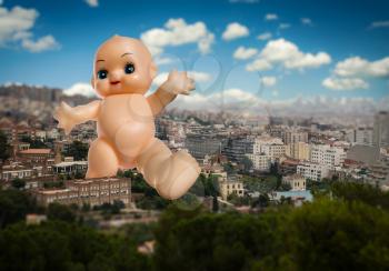 Strange giant baby doll goes across the town