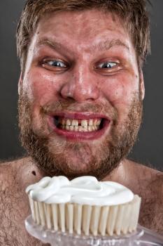 Ugly man preparing to brushing teeth