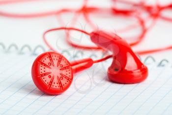 Red headphones on notebook horizontal view