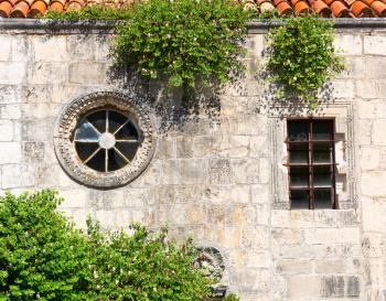 Old stone wall with windows