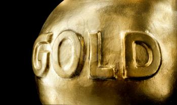 Big bullion of gold. Isolated on black