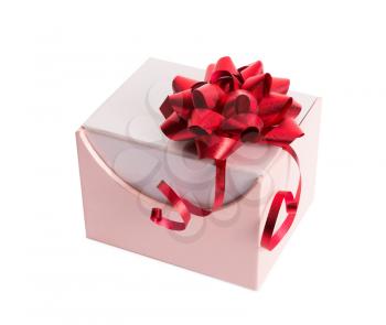 Pink gift box with red ribbon and bow on white