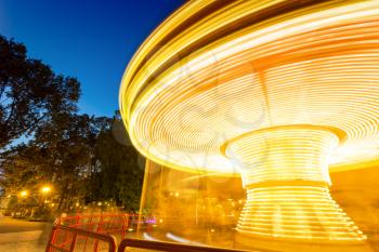 Fast merry-go-round lighting in the night