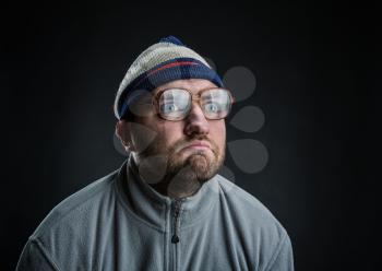 Bizarre man in hat and in glasses 