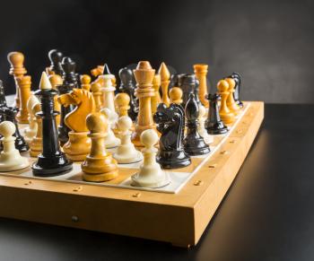 A lot of chess figures standing on the board