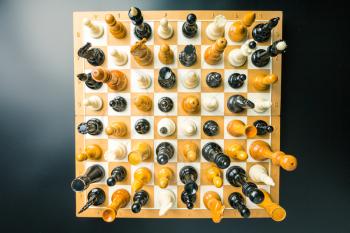 Up view of chess figures standing on the board