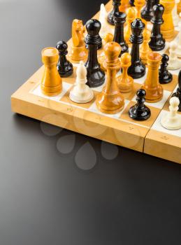 Many different chess figures standing on the board
