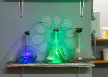 Three flasks with chemical reagents