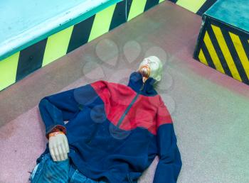 Death imitation, mannequin lying on the floor in the lab