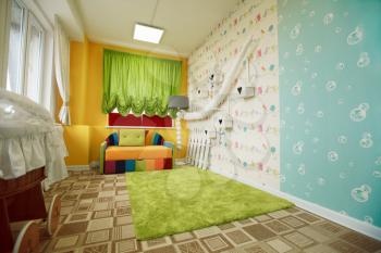 Kindergarten room decorated with colorful sofa. Preschool playroom concept.