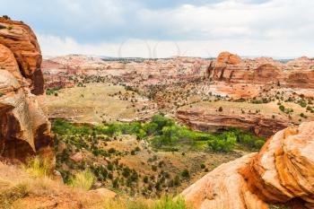 Monument valley landscape at sunny day. Blue sky and clouds on background.