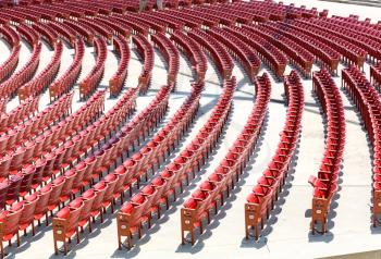 Empty open air theater red color circular placed seats
