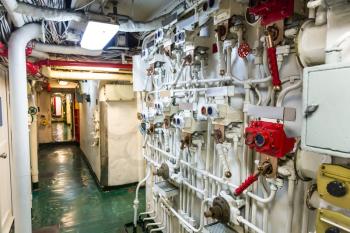 Aircraft carrier corridor with partitions, fire pipeline and wiring system. Midway museum