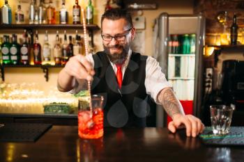 Attractive alcoholic drink preparation show. Professional bartending