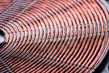 Induction heater copper coil closeup. Electric wires macro detail