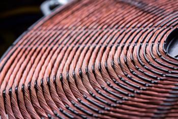 Induction heater copper coil closeup. Electric wires macro detail
