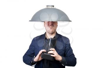 Professional photographer with lampshade on the head and digital camera in hands, white background. Cameraman works at studio