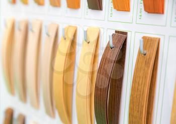 Wooden veneer samples palette closeup. Interline texture catalog. Face line wood decoration