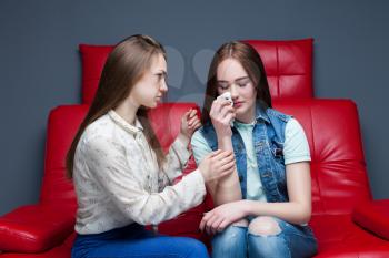 Girl calms her upset girlfriend, female friendship. Women secrets