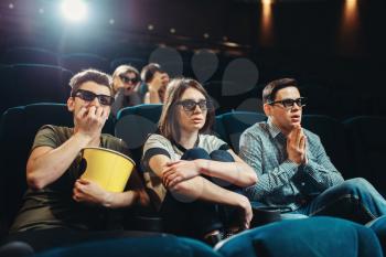 Smiling friends watching 3d movie in cinema. Showtime, entertainment industry technologies